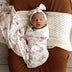 Baby wrapped in Butterfly Organic Jersey Wrap & Topknot Set | Snuggle Hunny