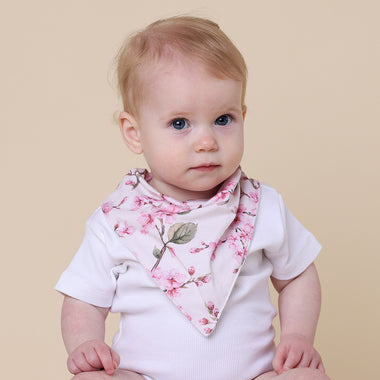 Toddler wearing Cherry Blossom Organic Dribble Bib