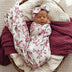 Baby wrapped in Cherry Blossom Organic Jersey Wrap & Topknot Set