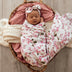 Baby wrapped in Cherry Blossom Organic Muslin Wrap