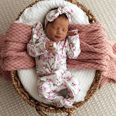 Baby wearing Cherry Blossom Organic Snuggle Sleepsuit Zip Footie with Frill