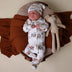 Baby wearing Diggers & Tractors Organic Snuggle Sleepsuit Zip Footie | Snuggle Hunny
