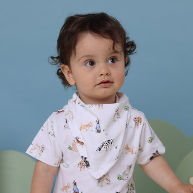 Toddler wearing Dog Park Organic Dribble Bib | Snuggle Hunny
