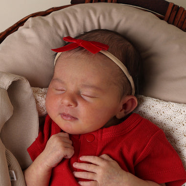 Baby wearing Red Velvet Bow | Snuggle Hunny