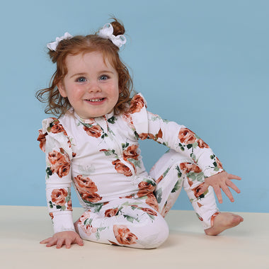 Toddler wearing Rosebud Organic Snugglesuit Convertible Romper with Frill | Snuggle Hunny