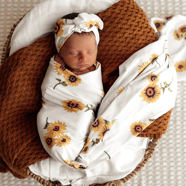 Baby wrapped in Sunflower Organic Jersey Wrap & Topknot Set